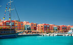 panoramic seascape on colorful Marina promenade street from Red Sea with moored motor yachts